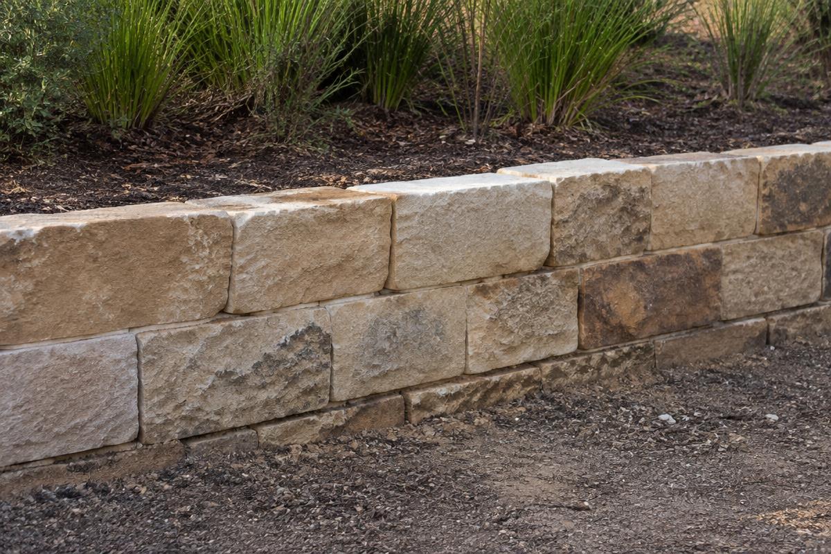 An ordinary sandstone retaining wall in natural afternoon light